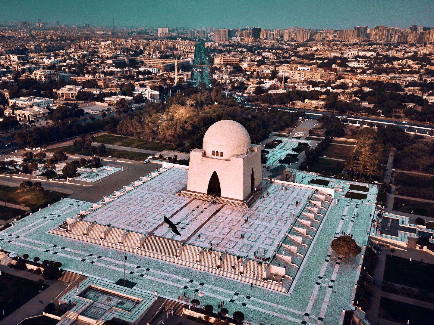 Mazar-e-Quaid and Karachi skyline, the local setting for Pakistan legal services